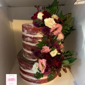 2 tier semi naked red velvet engagement cake fresh flowers red pink white green burgundy